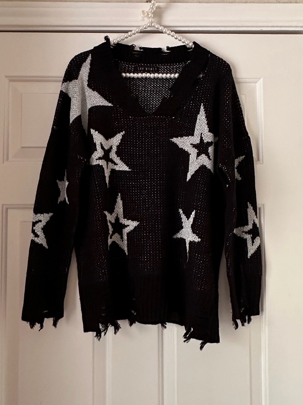 Say What Black/Metallic Distressed Star Sweater